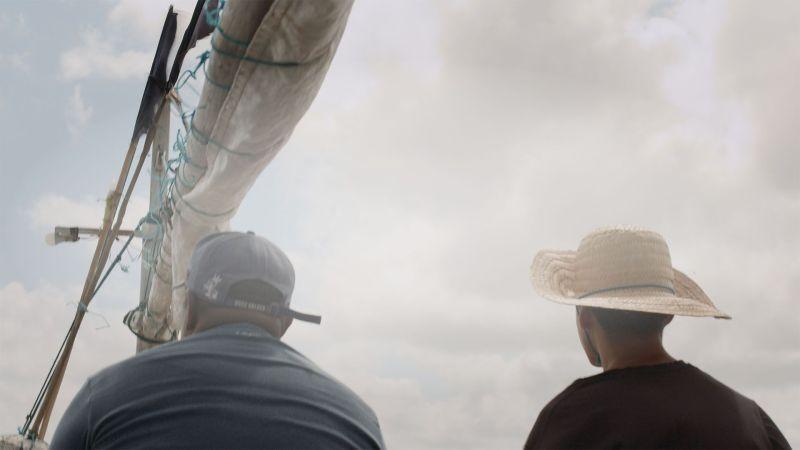 two people on a boat