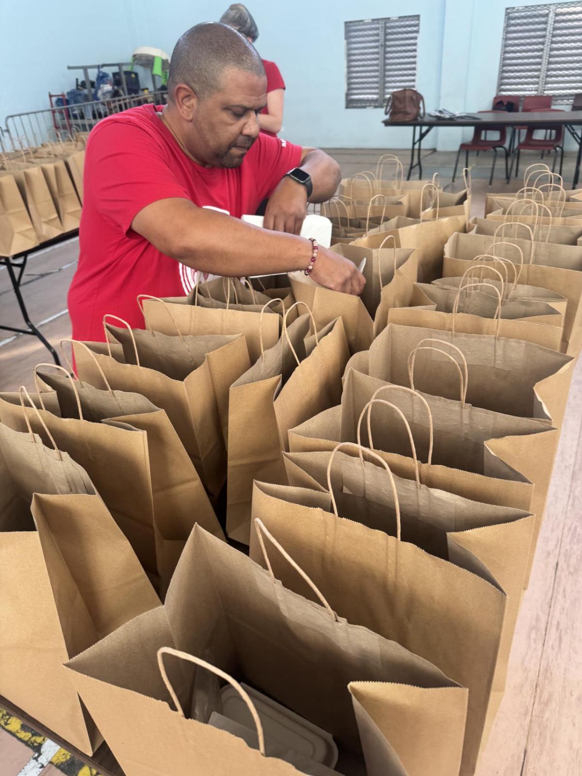 Bacardi employee filling bags