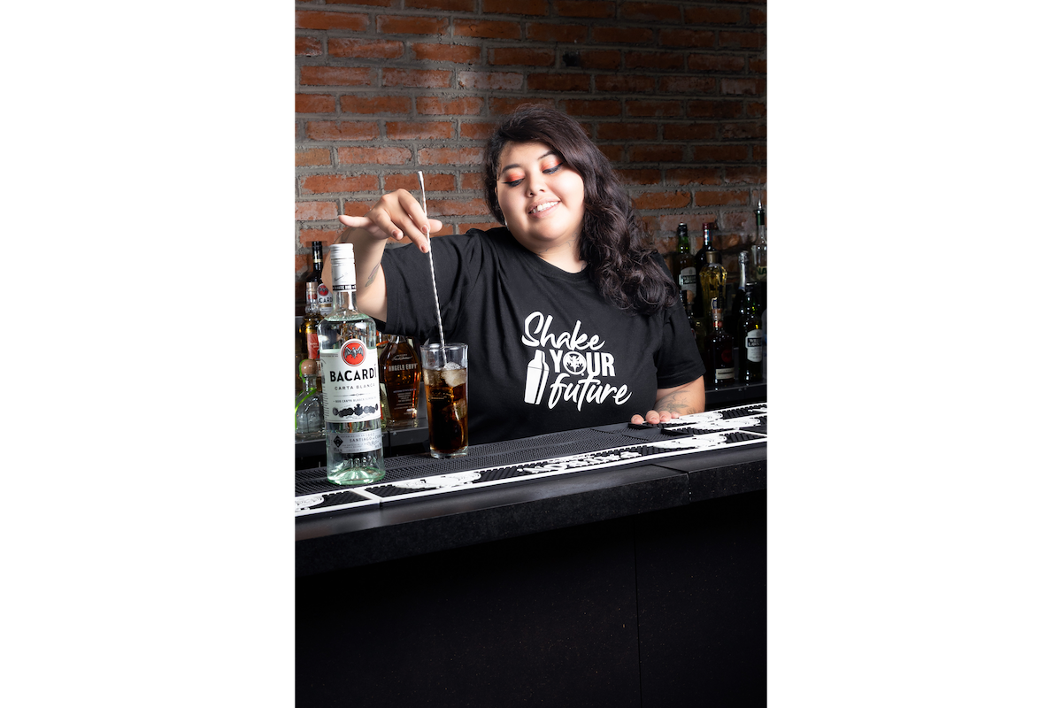 person mixing a drink