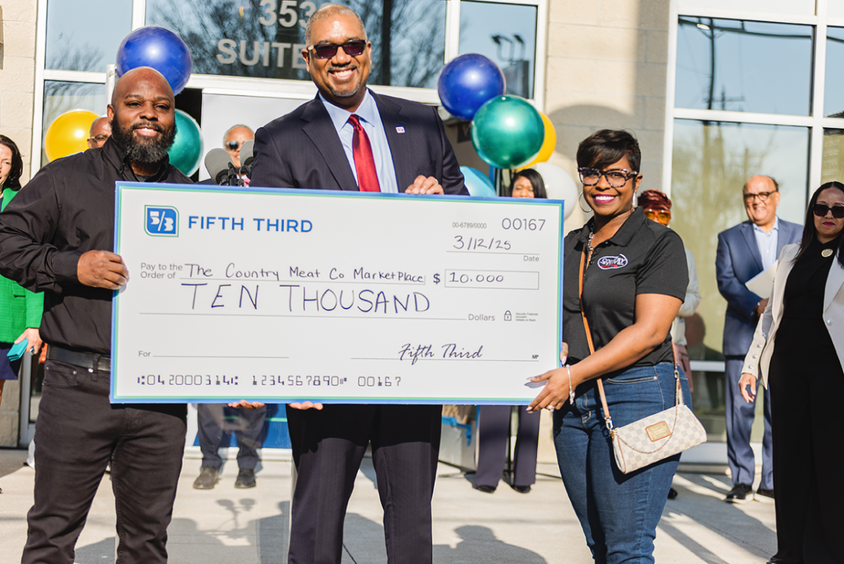 People holding an oversized check from Fifth Third