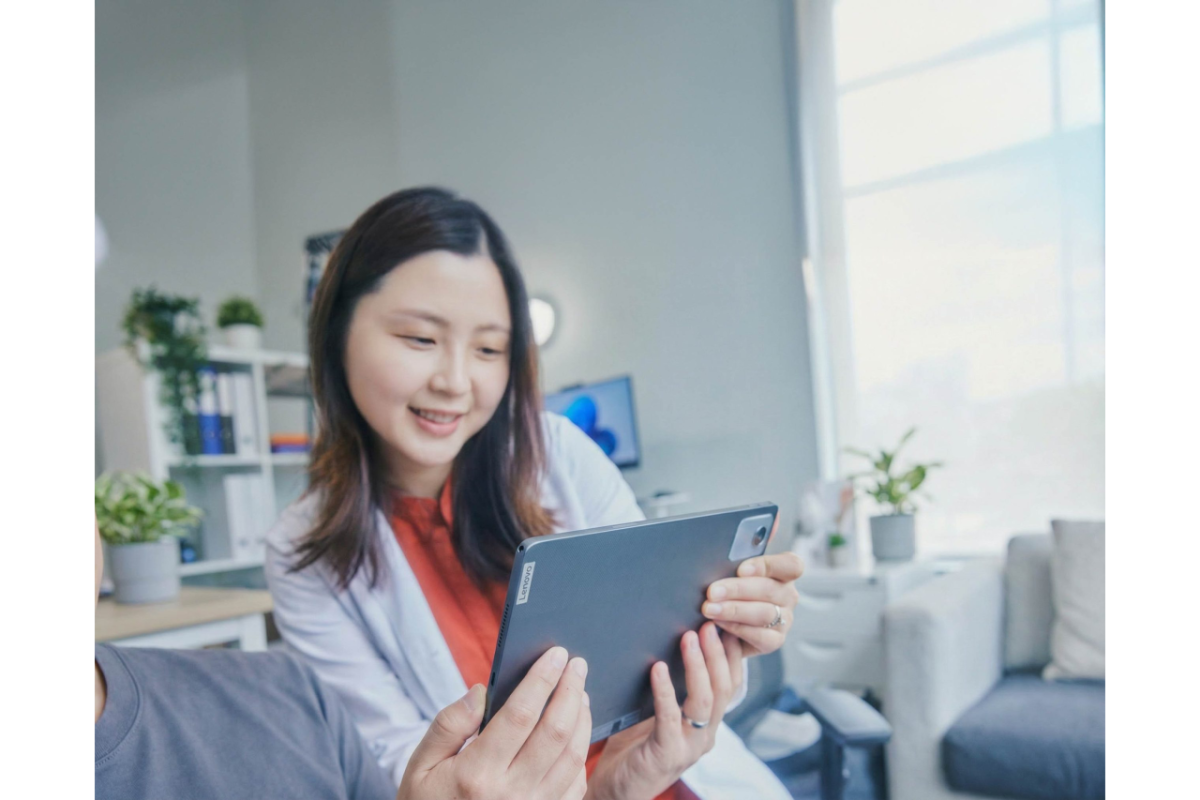 people looking at a tablet
