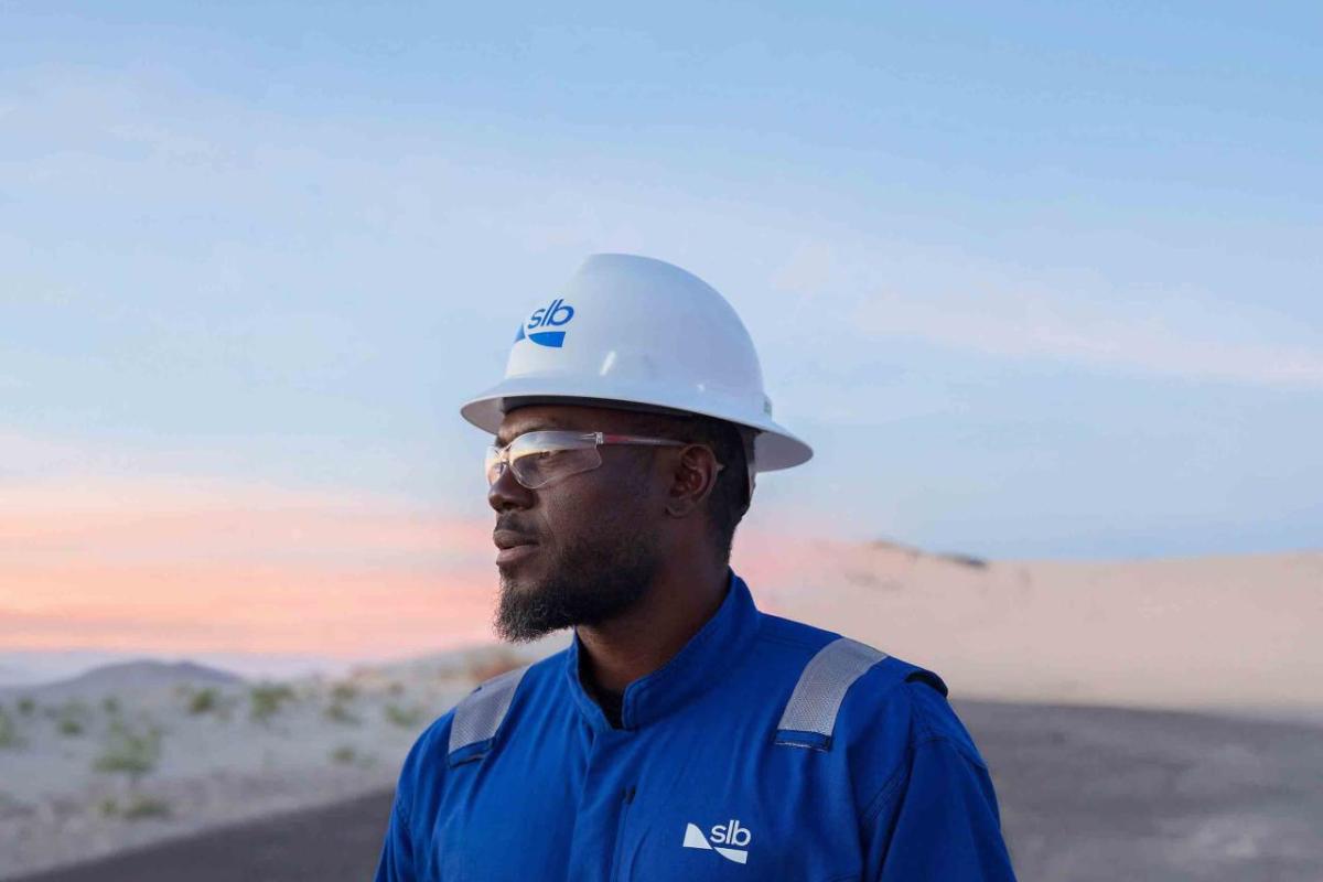 person with a helmet on looking at the landscape