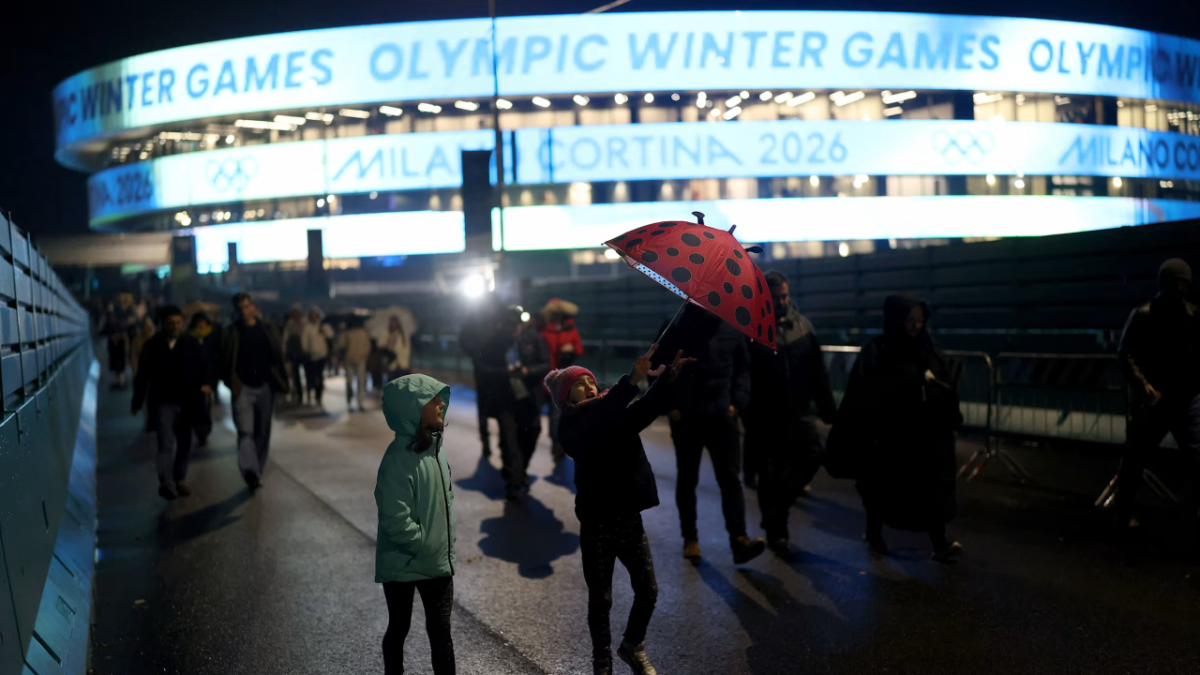 Pedestrians walking outside Olympic stadium