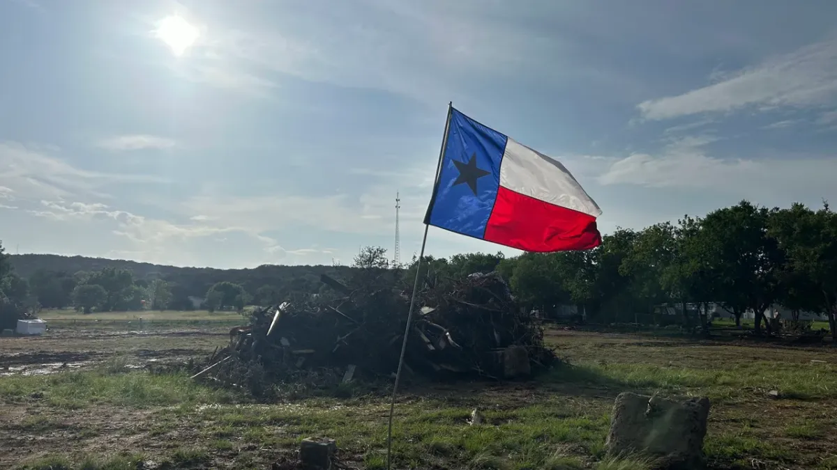 A flag waves in Hunt, Texas, on July 15, 2025, after floods inundated much of the Texas Hill County region. Direct Relief is working to support recovery in the region with emergency grant funds. (Shannon Hickerson/Direct Relief)