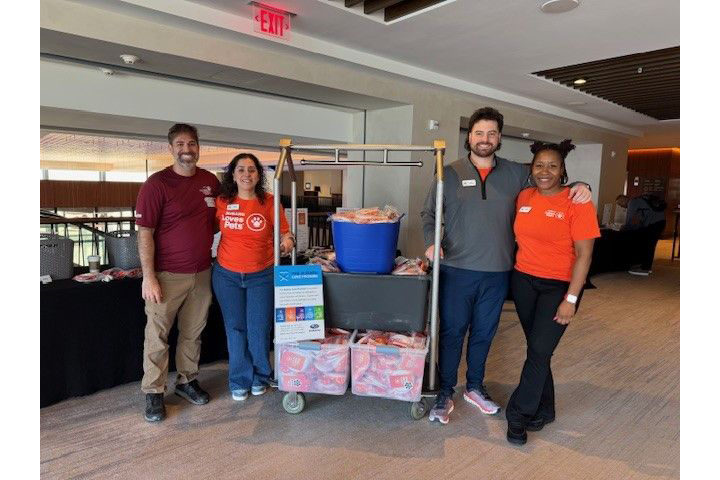 Volunteers with assembled pet adoption kits