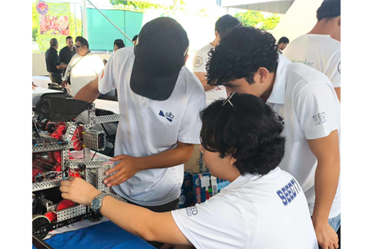 three students working on a project