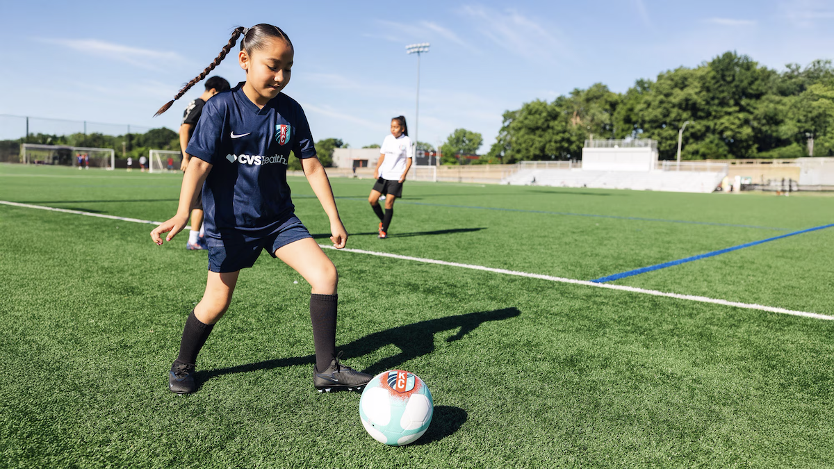 child playing soccer