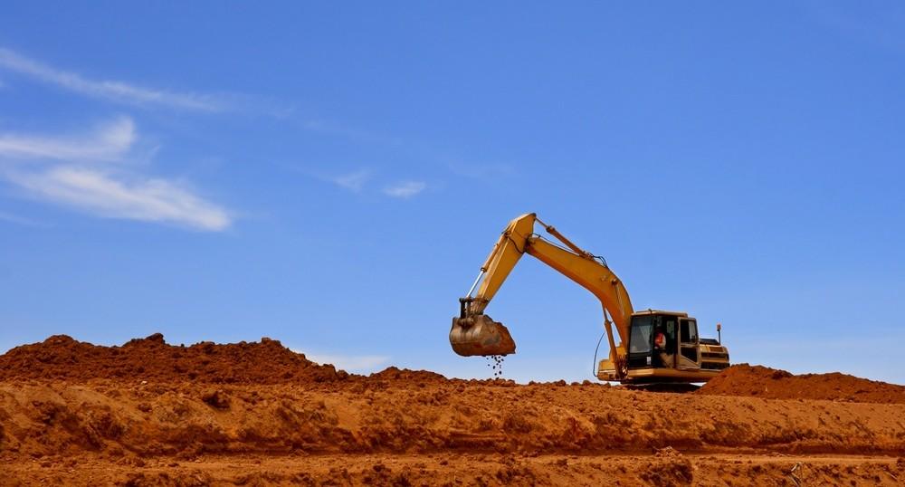 Landscape shot of an excavator digging in soil