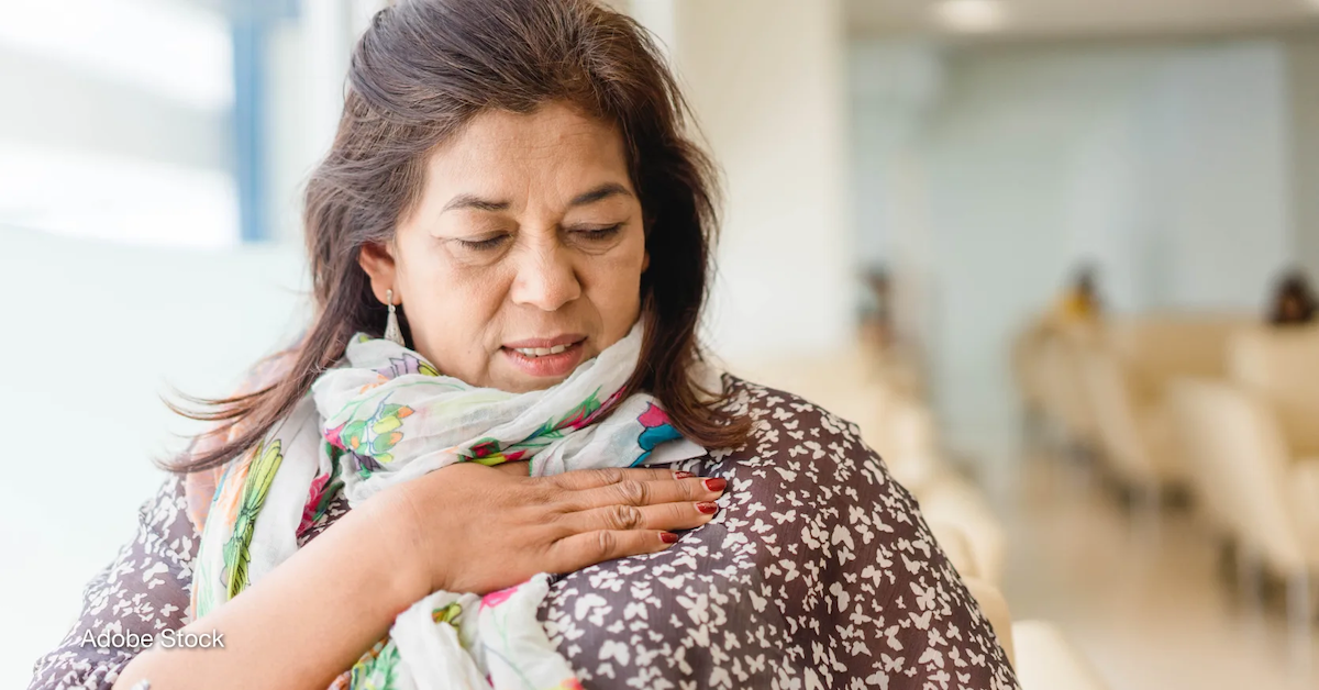 A woman stands in a clinic at a cancer checkup in India. Photo by: Adobe Stock
