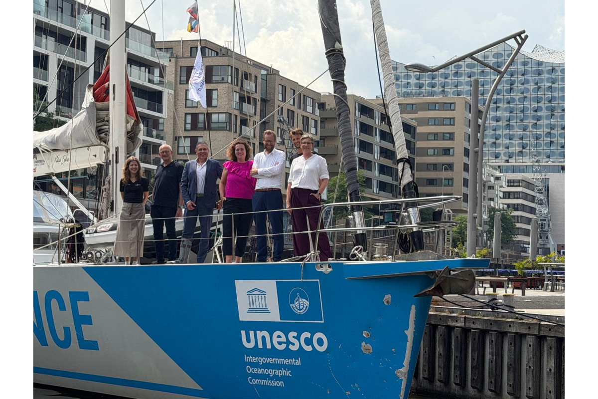 People standing on bow of ship
