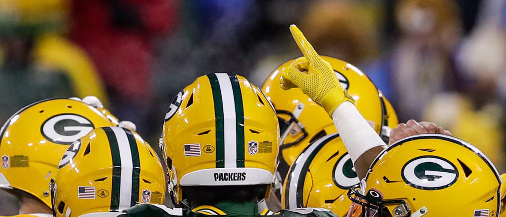 Green Bay Packers in a huddle.