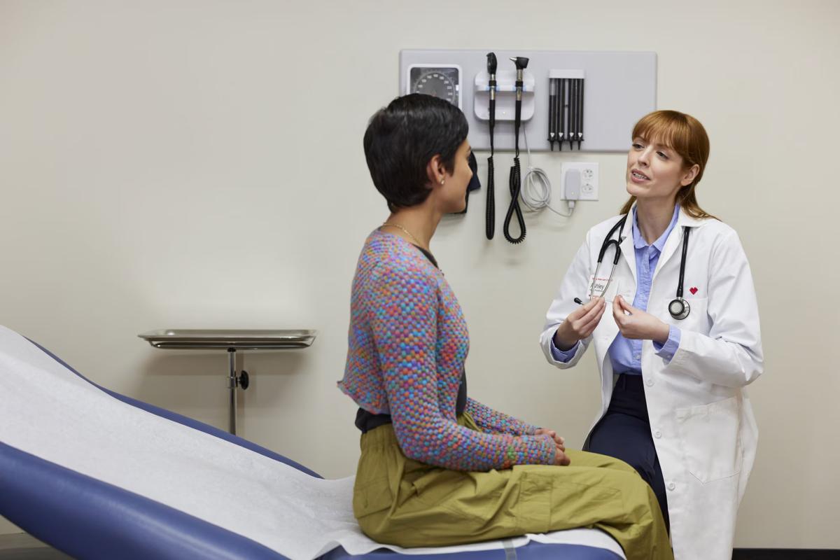 A woman being examined by a female doctor.