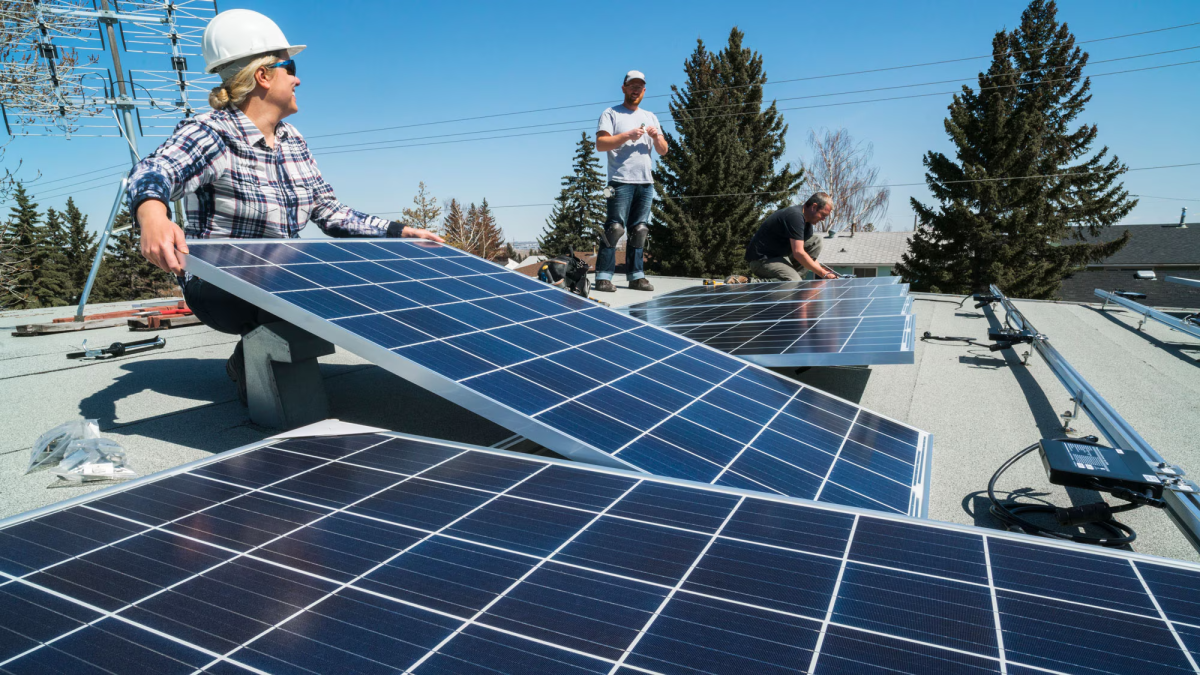  workers installing solar panels