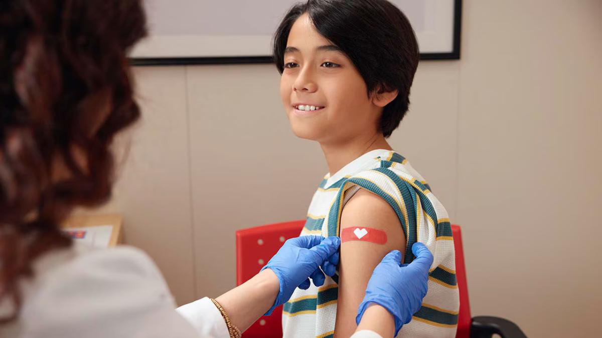 Patient shown with a medical professional.
