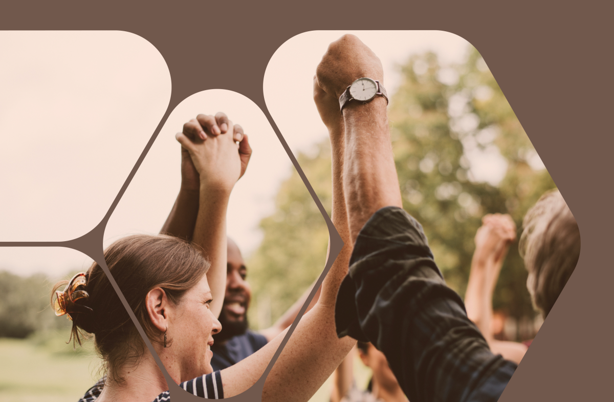 Group holding their hands in the air