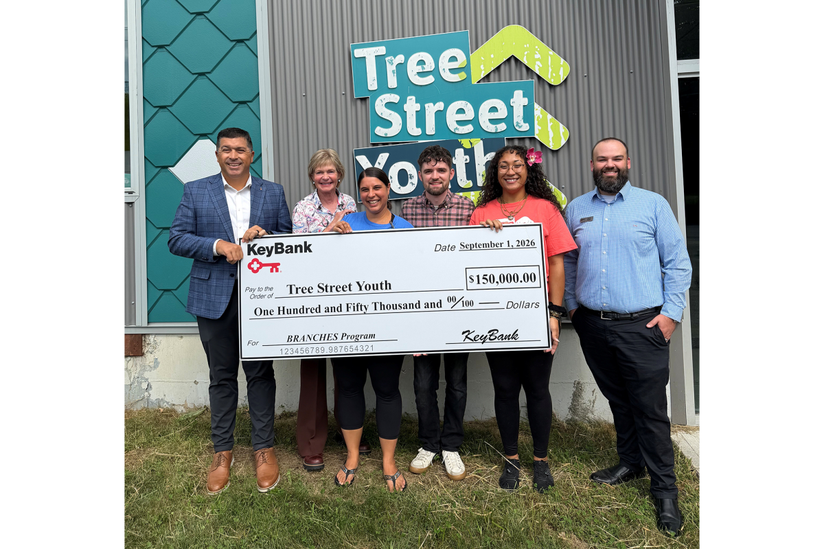 Representatives from KeyBank and Tree Street youth shown with $150,000 grant check.