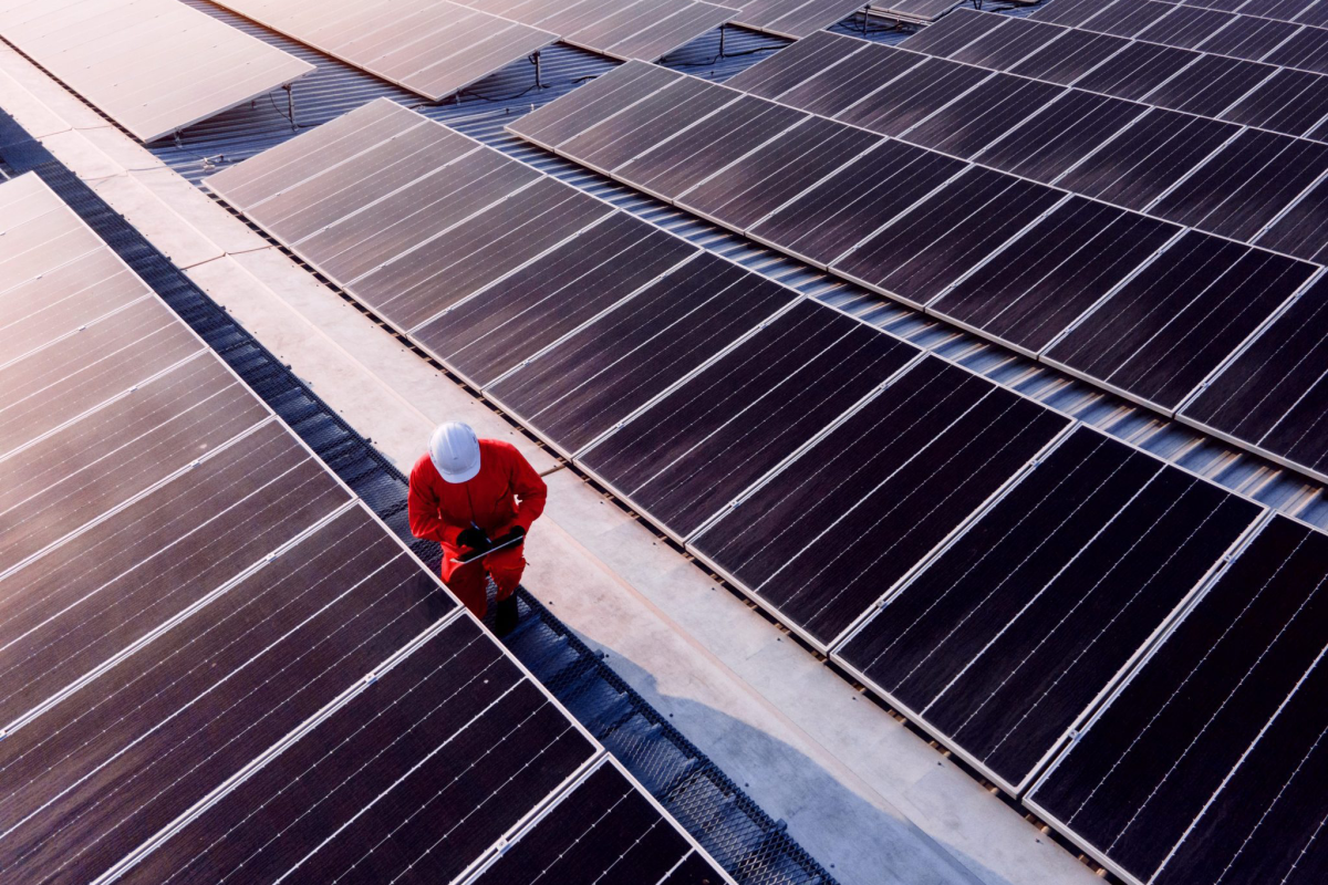 person working on solar panels