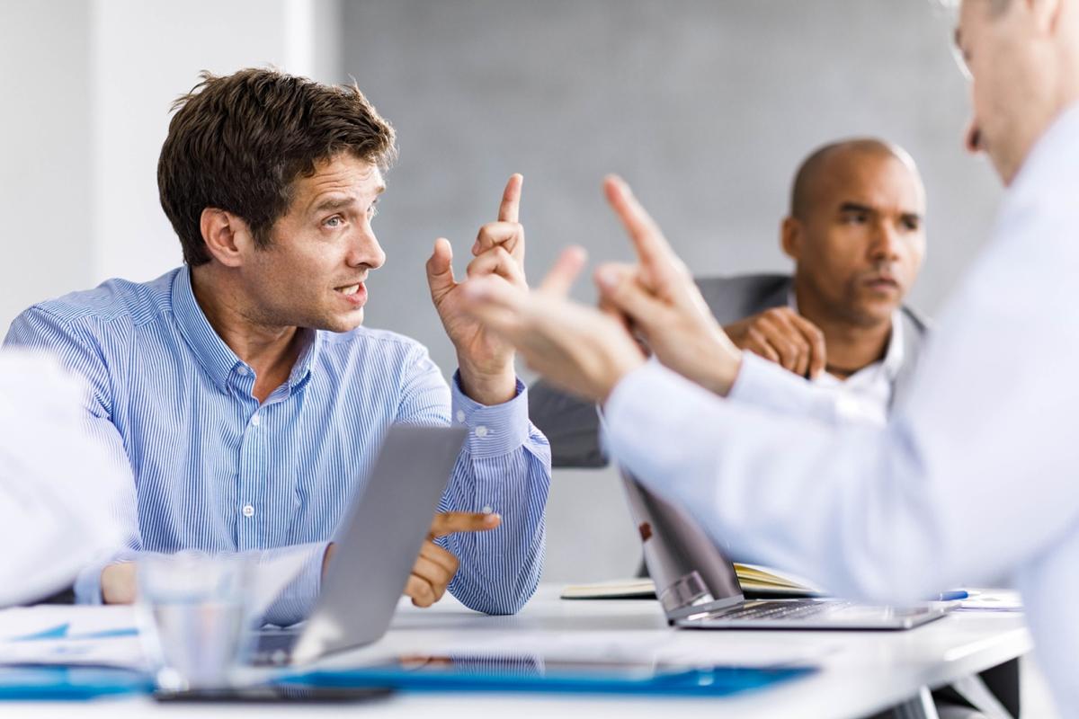 People arguing across an office table