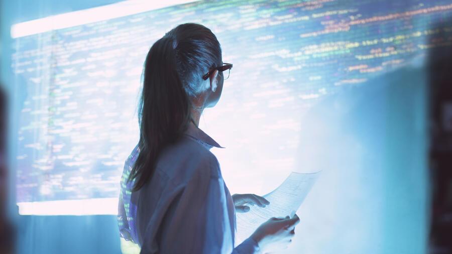 person looking at a screen of computer code
