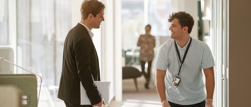 Two people having a discussion in an office.