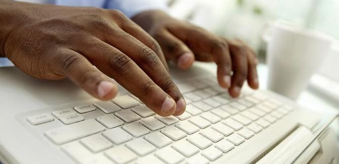 hands typing on a keyboard