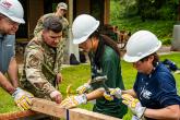 Instructor showing students how to build a structure 