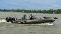 Detroit refinery Board Operator Fred Wickenheiser drives his boat with veterans for a day of fishing.