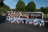 Group photo of Southwire volunteers in front of Project GIFT trailer