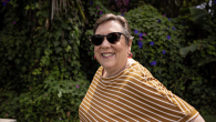 person smiling and wearing sunglasses