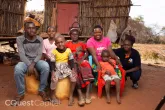 Joyce with her family and C-Quest Capital field officer. Image credits: C-Quest Capital