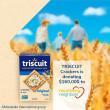 Family walking through cornfield with box of Triscuits and text that reads "TRISCUIT Crackers is donating $160,000 to nourishing neighbors"