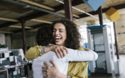 Two people embracing and smiling