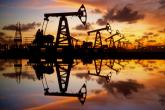 Oil wells with a sunset in the background