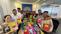 The Gen team working to reuse paper to donate notebooks