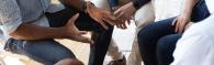 group of hands at a meeting