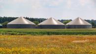 3 silos in a field
