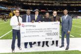 group holding up large check