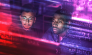 2 people looking at a computer screen