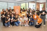 volunteers posing for a group photo with CARE packages
