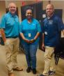 Aflac volunteers shown with representatives from the Chattahoochee Valley school district.