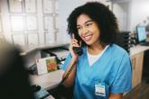 A medical professional taking a phone call.