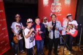 band posing together with instruments