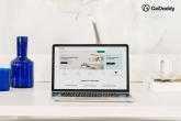 Laptop shown on a white desk with a white background.