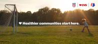 Healthier communities start here. Young person playing soccer.