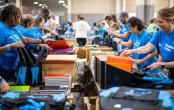volunteers packing backpacks