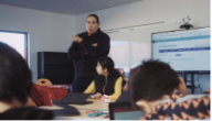 Teacher at the front of the classroom