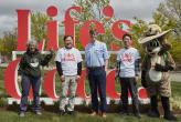 Group photo in front of "Life's Good" sign