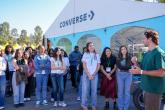 Group of students listening to speaker outside