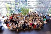 Group of men and women looking up at a photographer 