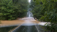 Road washed out by rushing water